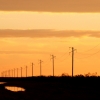 18-a-lonely-string-of-power-lines-fades-into-the-distance